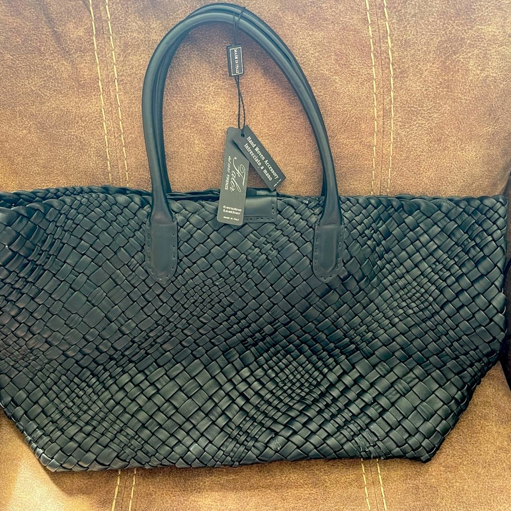 Black Falor hand woven, genuine leather bag. Never used. Excellent condition.